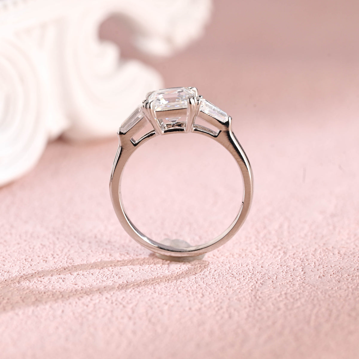 Close up angle shot highlighting the clean step-cut facets of an asscher lab diamond ring.