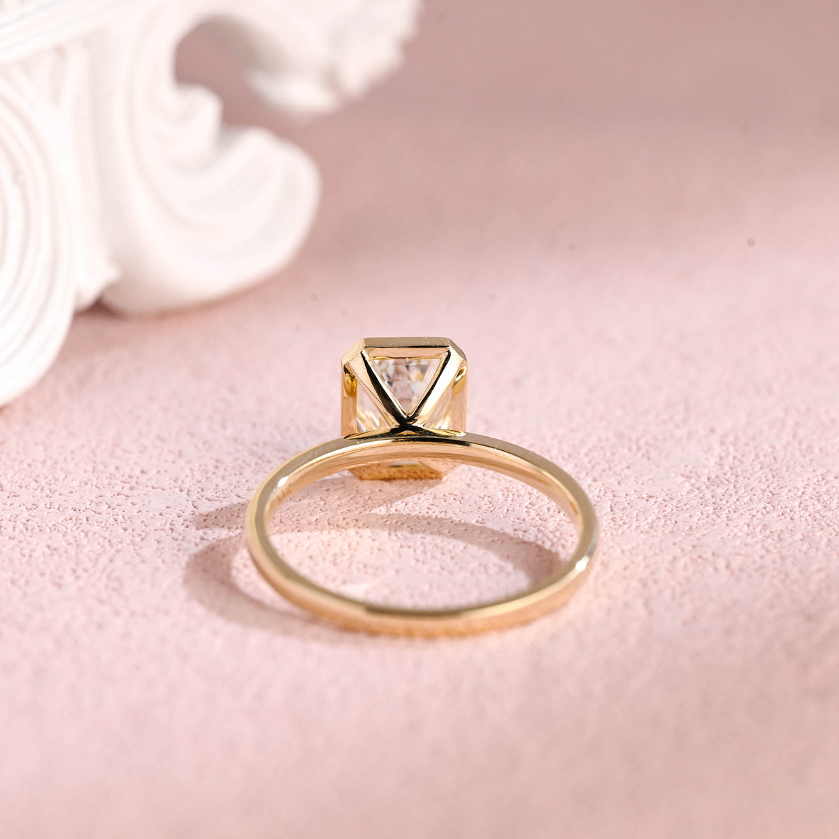 Bottom gallery view of the bezel set emerald lab grown diamond ring showing craftsmanship.
