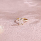 A luxurious emerald cut lab grown diamond engagement ring with micro-pave accent stones on the band and a d color vs1 center stone in white gold.