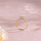 A luxurious emerald cut lab grown diamond engagement ring with micro-pave accent stones on the band and a d color vs1 center stone in white gold.