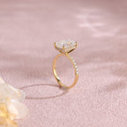 Side profile macro view of an emerald cut lab created diamond ring showing the intricate micro-pave basket and accent stones.