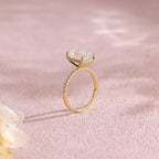A luxurious emerald cut lab grown diamond engagement ring with micro-pave accent stones on the band and a d color vs1 center stone in white gold.