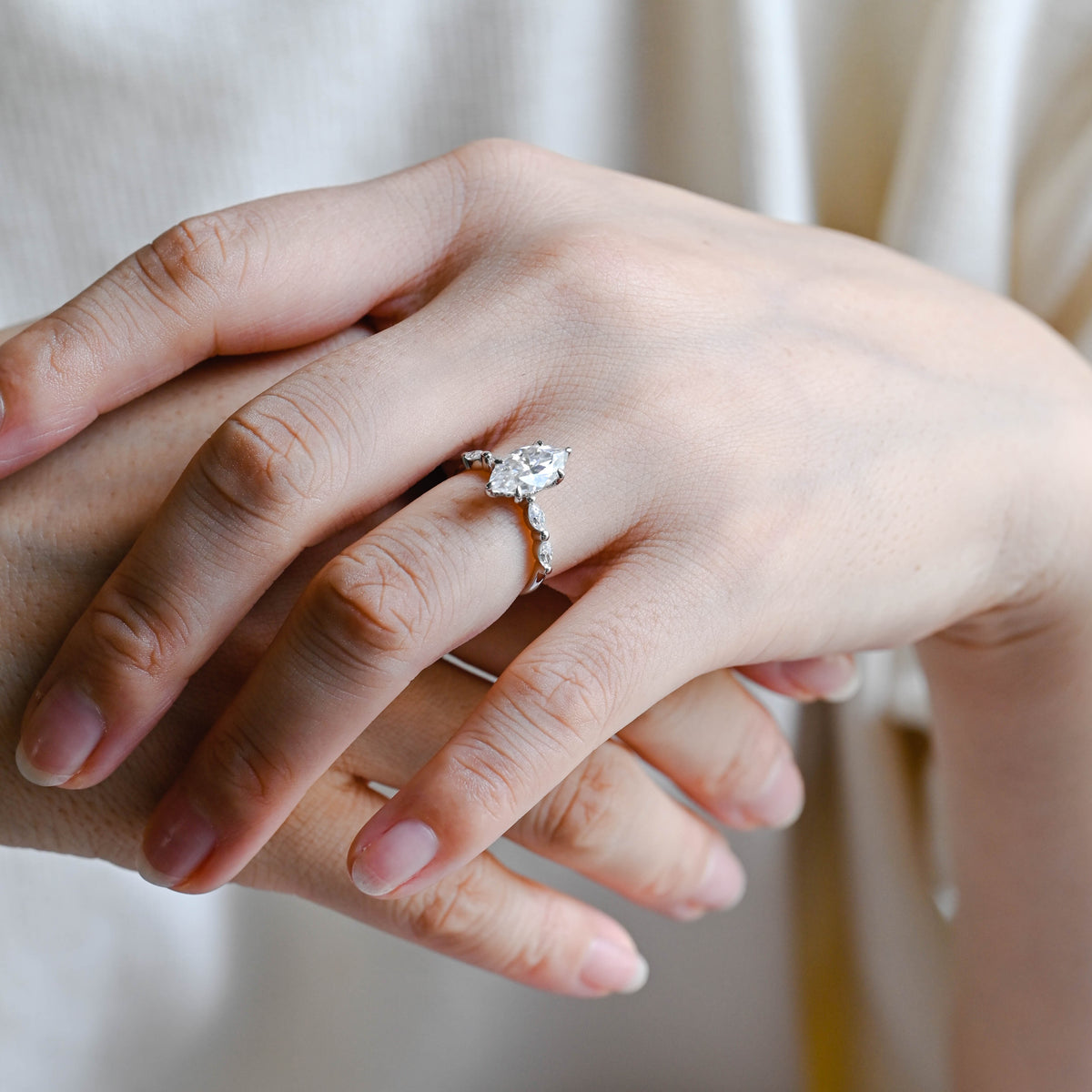 Premium ethical marquise cut lab diamond engagement ring presented inside a luxury box with official IGI certificate papers.