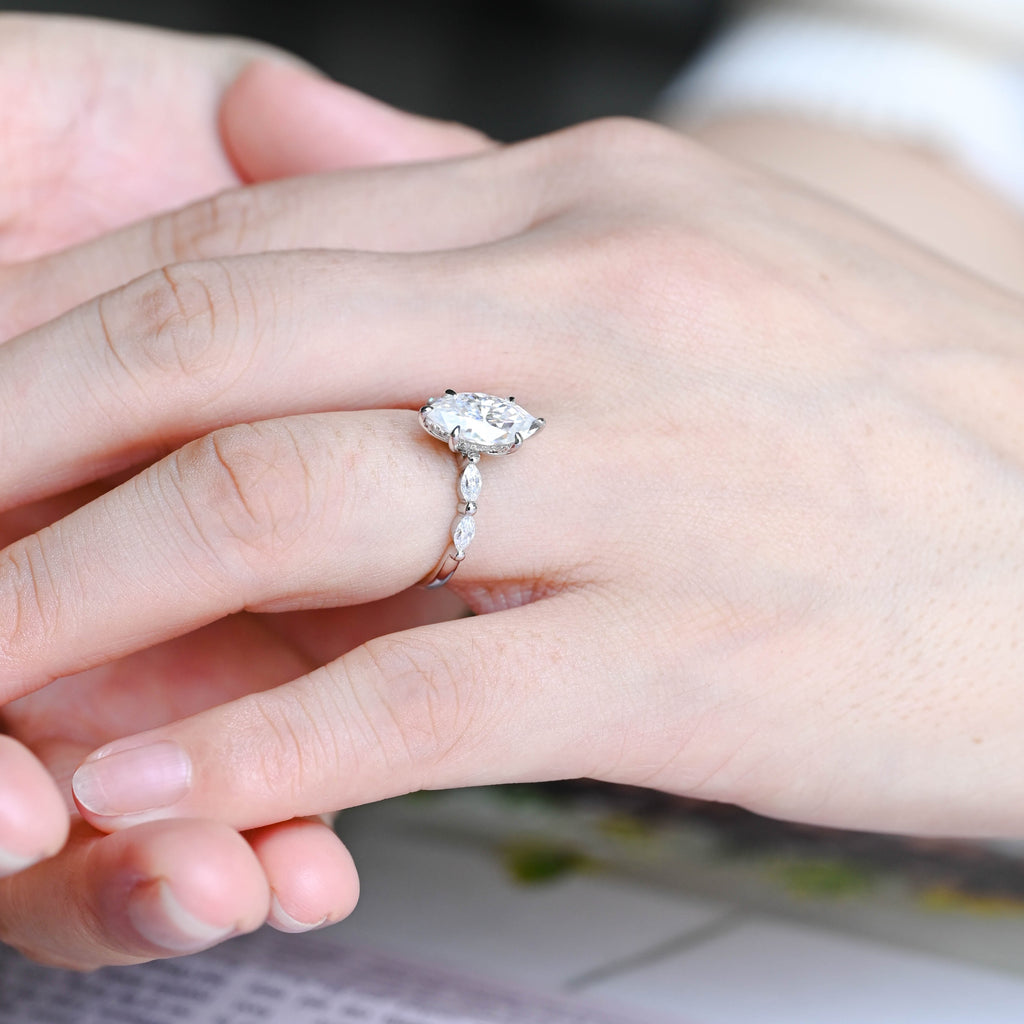 Premium ethical marquise cut lab diamond engagement ring presented inside a luxury box with official IGI certificate papers.