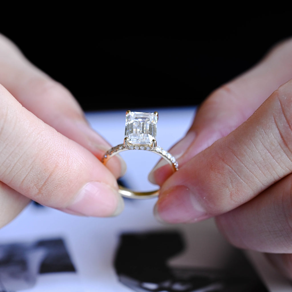 Exquisite emerald cut lab grown diamond ring with pave side stones showcased inside a premium luxury jewelry gift box.