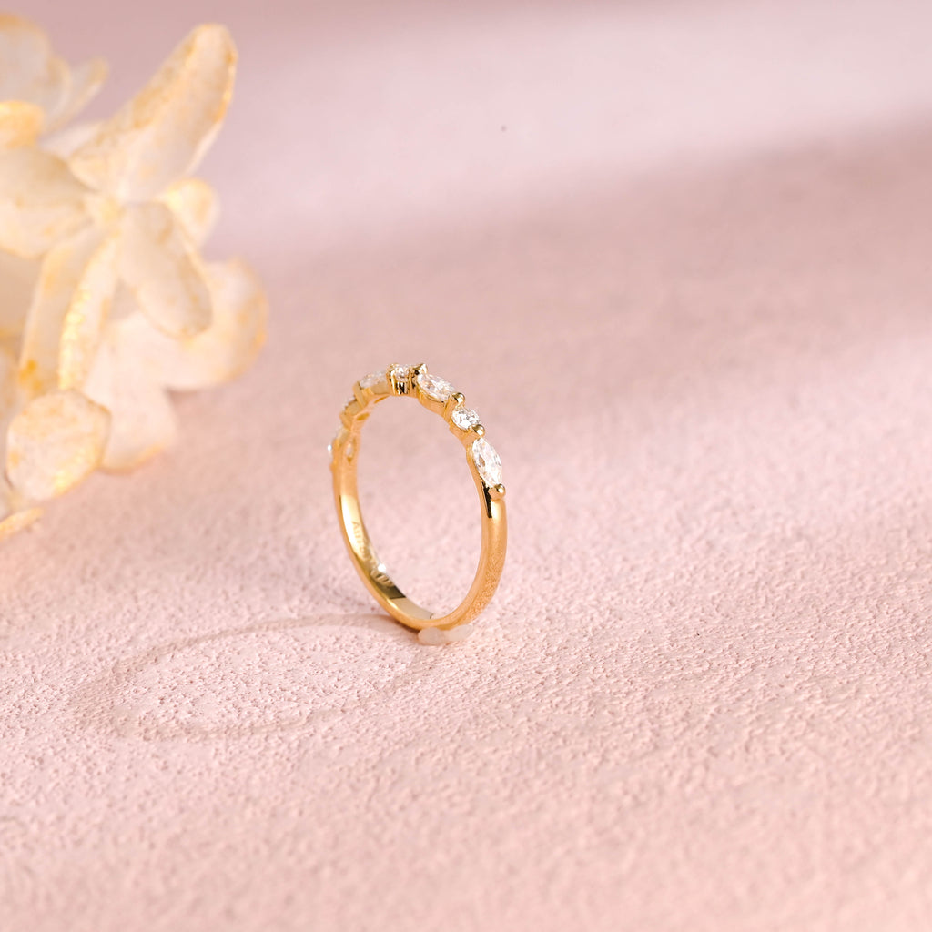 Side profile view of a cluster lab created diamond ring showing individual V-prongs and solid metal band.