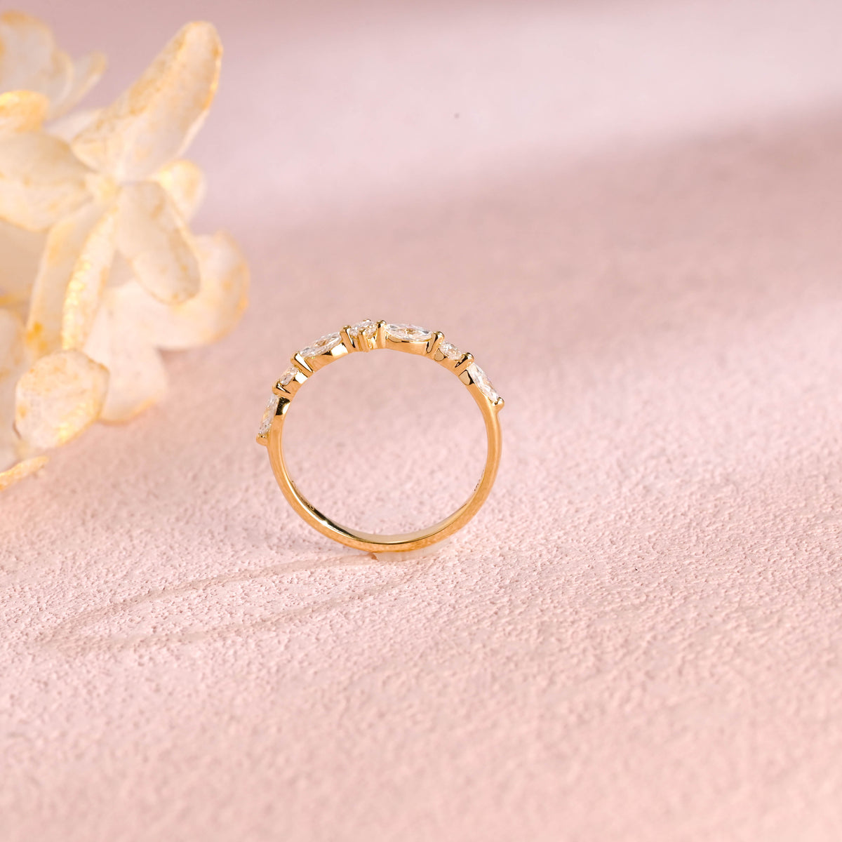 Side profile view of a cluster lab created diamond ring showing individual V-prongs and solid metal band.