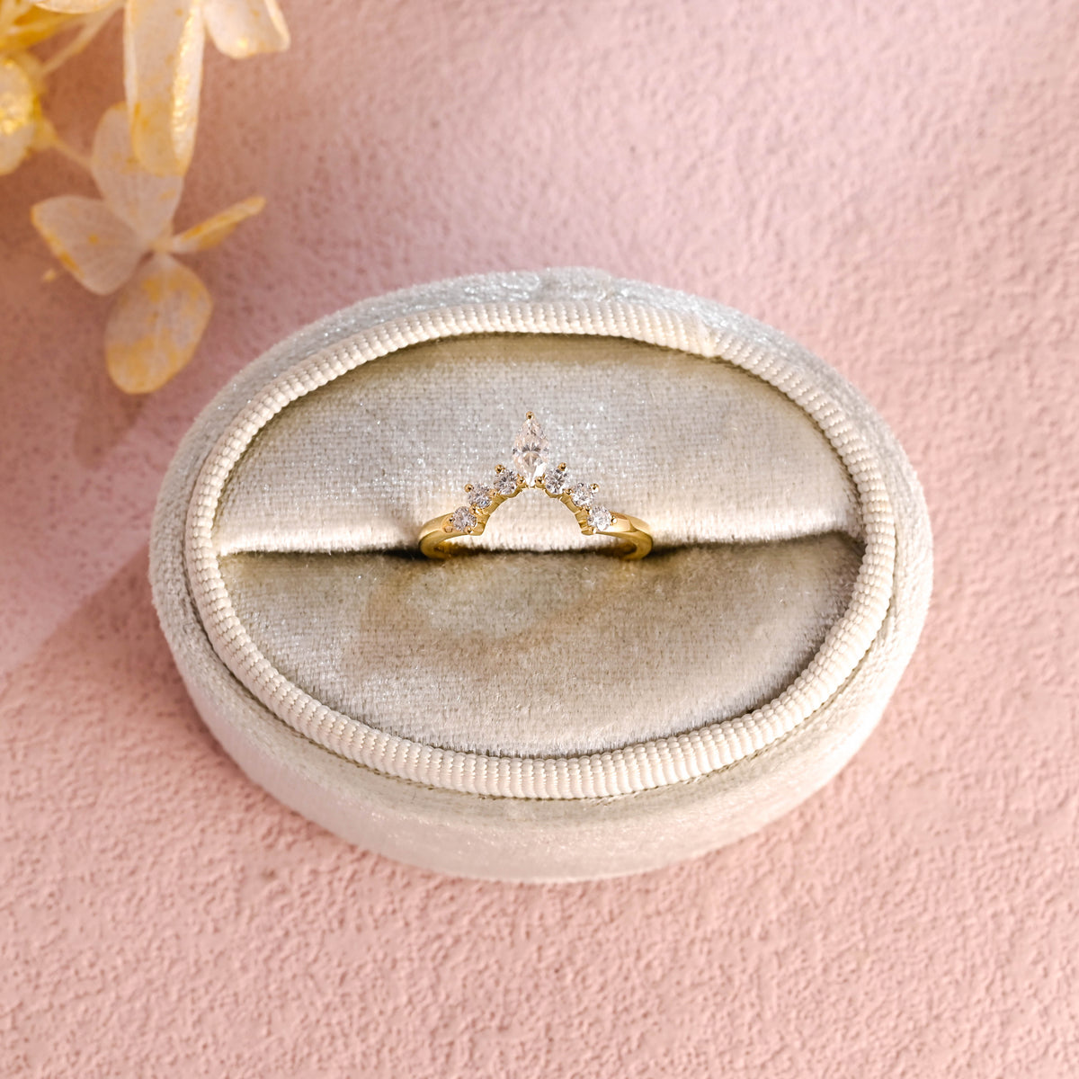 Side profile view of a marquise and round lab created diamond cluster stacking ring showing individual prong settings in white and rose gold.