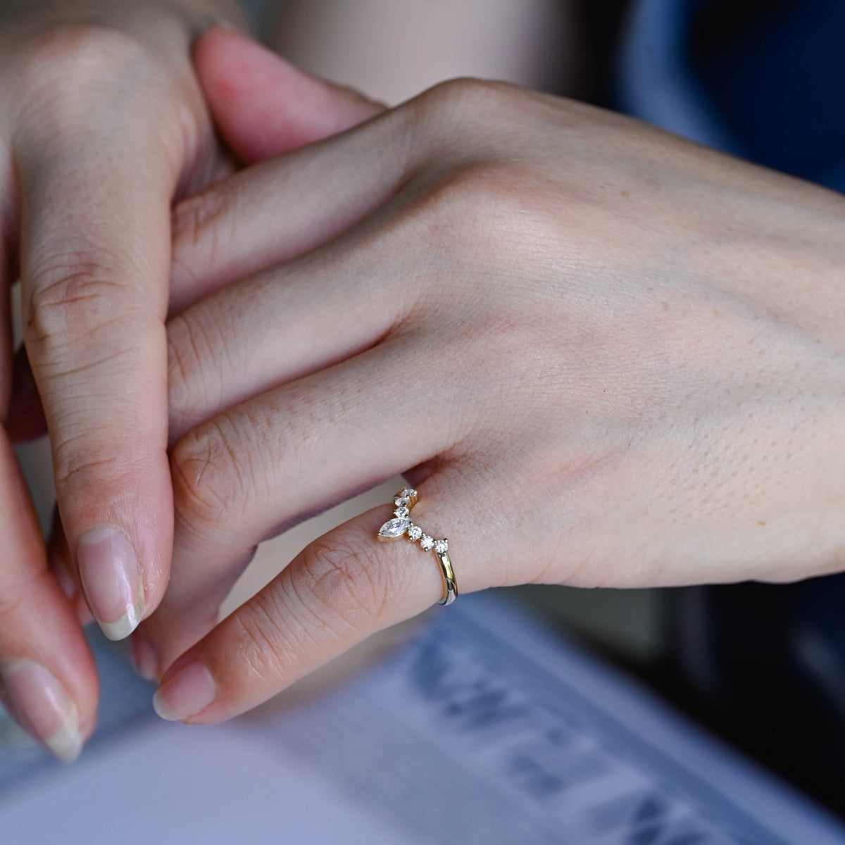 Dainty marquise and round lab grown diamond wedding band showcased inside a luxury gift box.