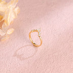 Side profile view of a marquise and round lab created diamond cluster stacking ring showing individual prong settings in white and rose gold.