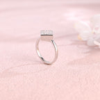 A minimalist 14k yellow gold princess cut lab grown diamond engagement ring featuring a sleek full bezel setting with a d color vs1 center stone.