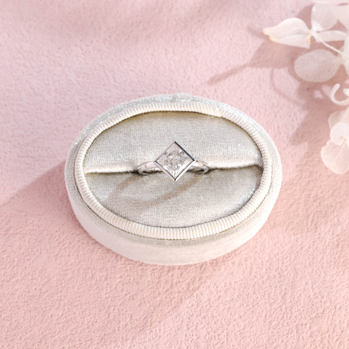 Side profile view of a modern princess cut lab created diamond full bezel setting showing the low-profile solid metal band design.