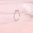 Side profile view of a modern princess cut lab created diamond full bezel setting showing the low-profile solid metal band design