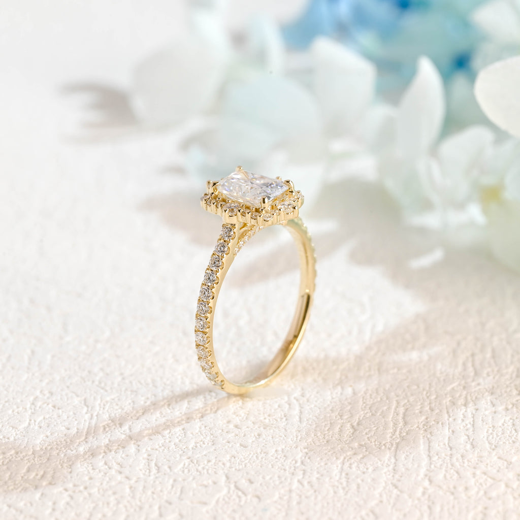 Side profile macro view of a radiant cut lab created diamond halo ring showing the intricate micro-pave basket and side stones.