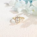 Side profile macro view of a radiant cut lab created diamond halo ring showing the intricate micro-pave basket and side stones.