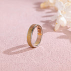A stylish unisex two-tone modern band ring featuring a contrasting yellow and white gold finish on a neutral studio background.